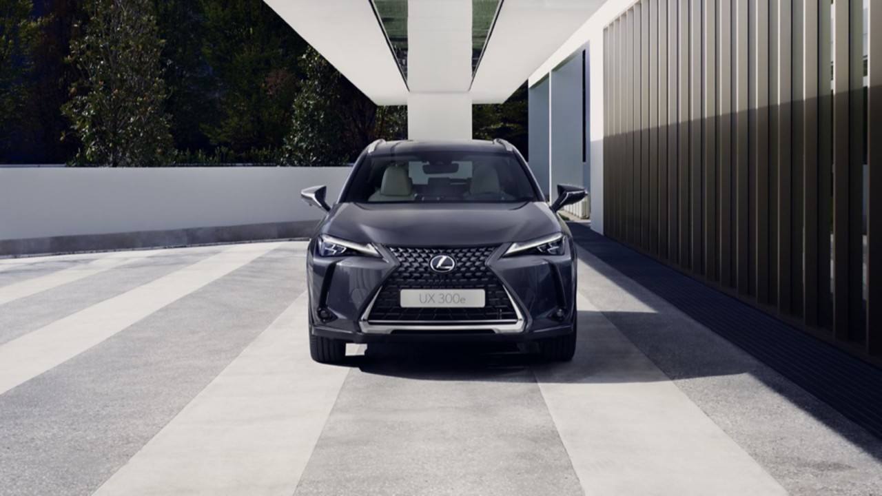Lexus UX driving in a city location 