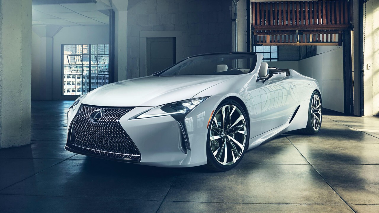 Lexus LC and LC Convertible parked in front of a racetrack 