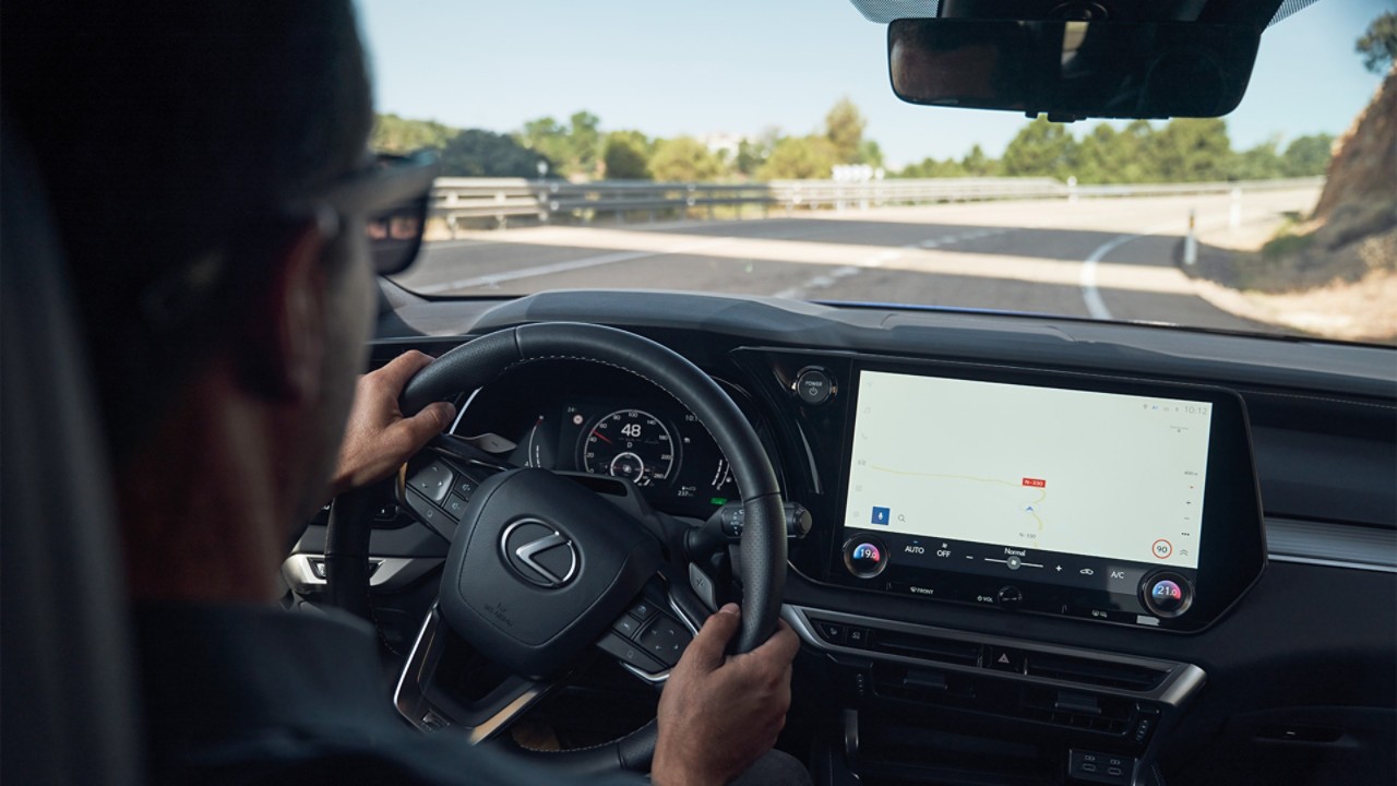 A man driving a Lexus RX