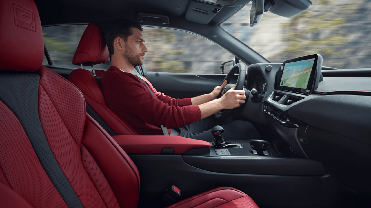 Lexus UX driving through a rural location 