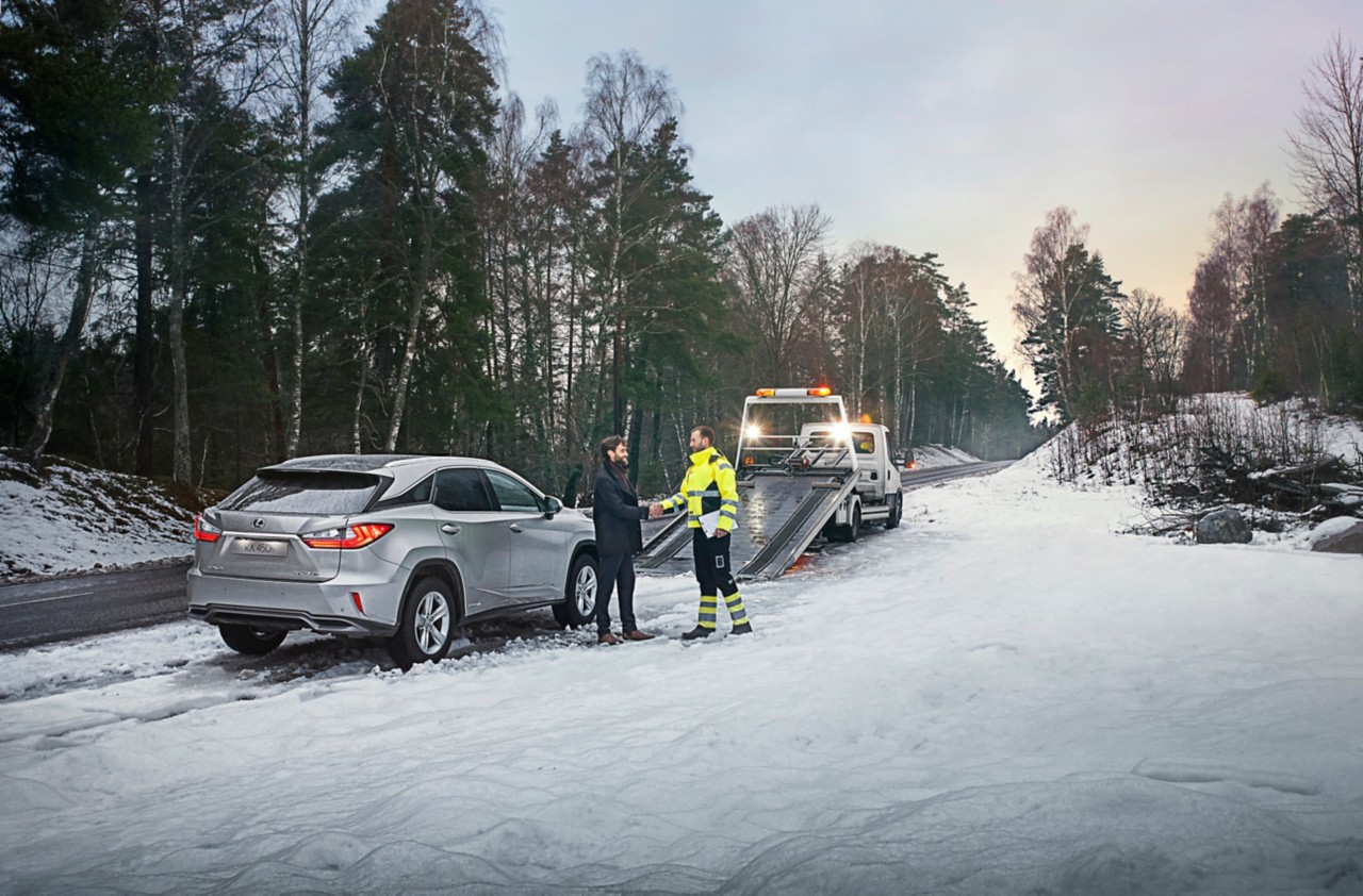 A woman driving a Lexus